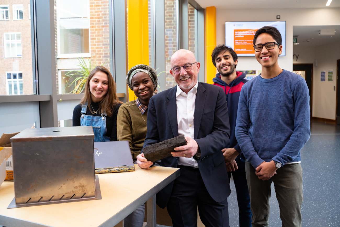 Ewan kirk with engineering students at the university of cambridge